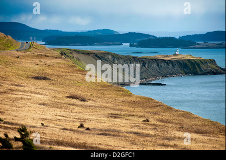 Poised on a steep wind swept bluff, the Cattle Point Lighthouse marks the southernmost tip of San Juan Island, Washington, USA. Stock Photo