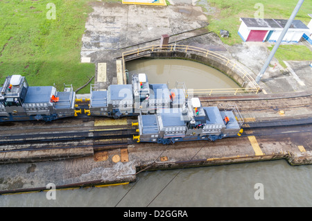 Panama Panama Canal Electric locomotive mules ready to assist ships through the Panama Canal Stock Photo