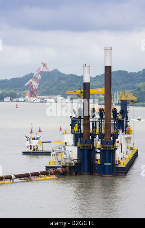 Panama Panama Canal A dredge and steel pipe used to deepen the waterway of the Panama Canal Stock Photo