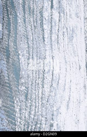 Textured background of distressed rustic wood with peeling blue and white paint Stock Photo
