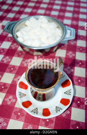 Turkish tea or çay, pronounced 'chai' traditionally served in a small tulip-shaped glasses without milk. Stock Photo