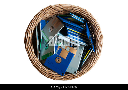 Old 3.5" computer disks thrown away in a waste paper basket. Stock Photo