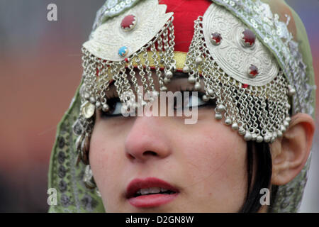 Jan. 24, 2013 - Kashmiri muslim  school girl dressed in traditional outfits sing during the full dress rehearsal for the Republic Day parade in srinagar, the summer capital of Indian Kashmir, on 24/1/2013. India in various cities showcased its military might and cultural heritage on 26 January as the country celebrated its 64rd Republic Day, marking the adoption of the constitution of India and the transition from a British Domination into a republic. Defence forces were displaying their latest armaments and colourful tableaux depicting the diverse culture from Indian states and performances b Stock Photo