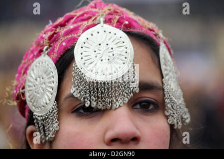 Jan. 24, 2013 - Kashmiri muslim  school girl dressed in traditional outfits sing during the full dress rehearsal for the Republic Day parade in srinagar, the summer capital of Indian Kashmir, on 24/1/ 2013. India in various cities showcased its military might and cultural heritage on 26 January as the country celebrated its 64rd Republic Day, marking the adoption of the constitution of India and the transition from a British Domination into a republic. Defence forces were displaying their latest armaments and colourful tableaux depicting the diverse culture from Indian states and performances  Stock Photo