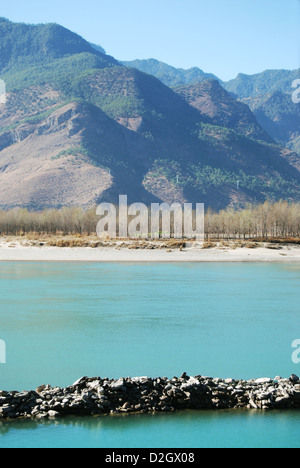 Peaceful and calm riverside blue water of Yunnan Province Yangtze River, China. Stock Photo
