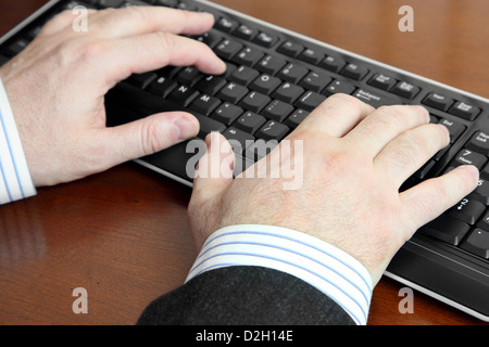 Male Hands Typing on Keyboard Stock Photo