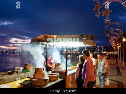 Cooking chestnuts in salt a madeiran speciality on the promenade waterfront in Funchal Madeira Portugal EU Europe Stock Photo