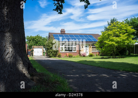 Country Bungalow with Solar Panels on Roof Stock Photo