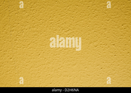 pale yellow structural painted wallpaper on the wall Stock Photo
