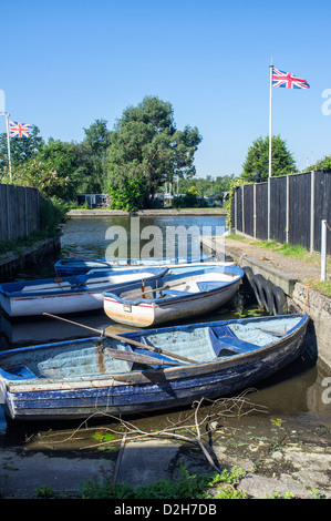 Rowing Boats Moored on the River Bure at Horning on the Norfolk Broads Stock Photo