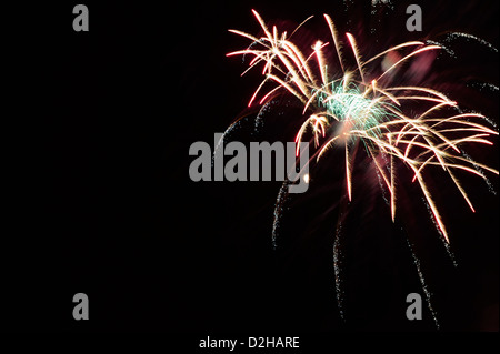 Fireworks explosions against the night sky in holiday celebration, a burst of color for use as design elements and backgrounds.