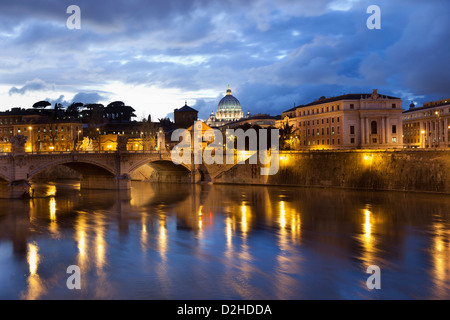 Night image of St. Peter's Basilica from the Ponte Sant Angelo and Tiber River in Rome - Italy. Stock Photo