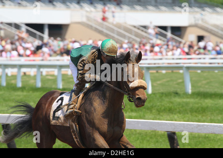 Mud covered Jockey. Horse Racing at River Downs track, Cincinnati, Ohio, USA. Stock Photo