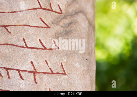 Old historic nordic runes engraved in stone. The stone is located at Rok in Ostergotland in Sweden Stock Photo