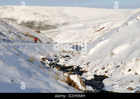 Walker on the footpath to Lyn y Fan Fach in snow Black Mountain Brecon Beacons National Park Carmarthenshire Wales Cymru UK GB Stock Photo