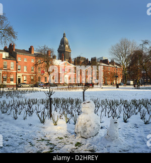 snowmen in park square by Leeds Town Hall built in 1858 designed by Cuthbert Broderick, wintertime,yorkshire, united kingdom Stock Photo