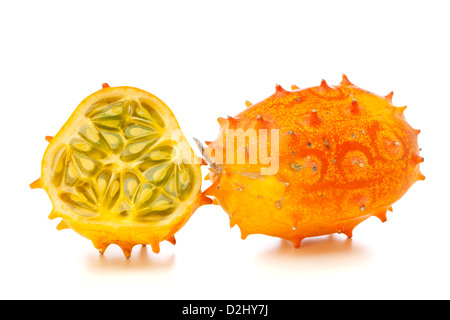Whole and half Kiwano fruits, also called African Horned melon or Horned Cucumber, isolated on white background Stock Photo