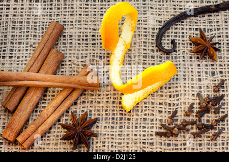 Aroma spices cinnamon anise vanilla and cloves on jute Stock Photo