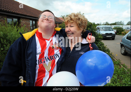 Man with learning disabilities with his carer at drop in centre, Northallerton, North Yorkshire. Stock Photo