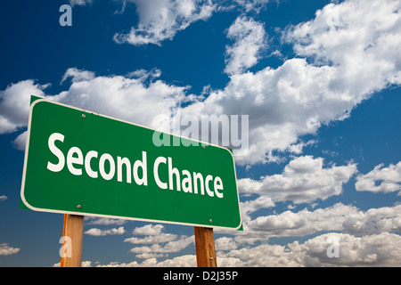 Second Chance Green Road Sign Over Clouds and Sky. Stock Photo