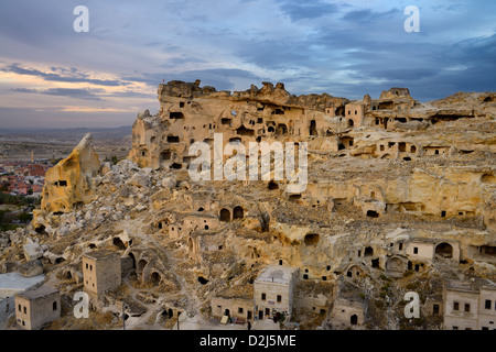 Ancient abandoned village of Cavusin with cave houses and wood footbridge to Church of St John the Baptist Cappadocia Turkey Stock Photo