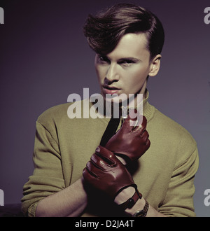 Fashion photo shot of a man wearing leather gloves Stock Photo