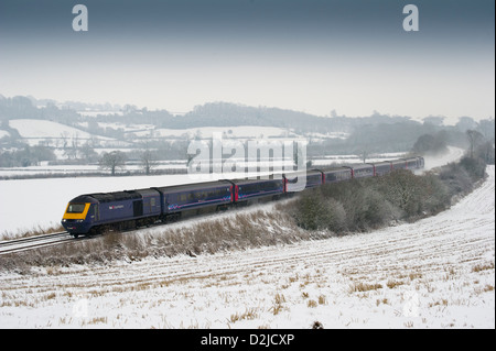A First Great Western High Speed Train descends Campden Bank near Mickleton, Gloucestershire in snowy conditions. Stock Photo