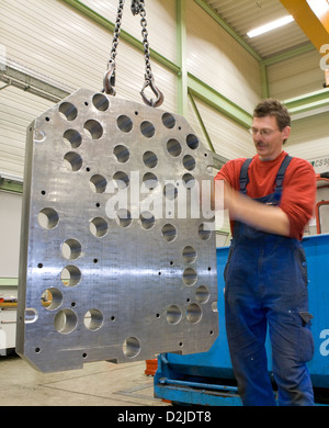 Riedlingen, Germany, a compression mold hangs at a crane Stock Photo