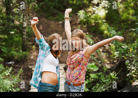 Young girls on the wooden bridge Stock Photo