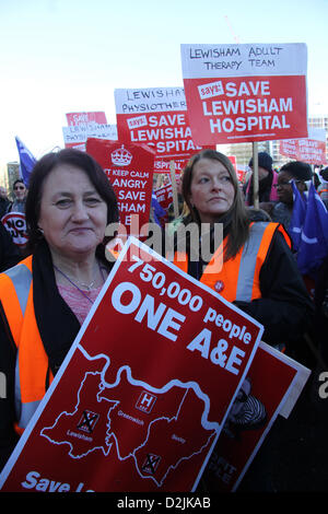 London, UK. 26th January 2013. Protesters hold placards as they wait for the start of the march through Lewisham Credit:  david mbiyu / Alamy Live News Stock Photo