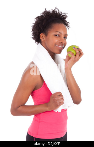 Young african american woman eating an apple over white background Stock Photo