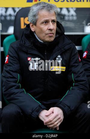 Gladbach's head coach Lucien Favre sits on the bench shortly before the start of the Bundesliga soccer match between Borussia Moenchengladbach and Fortuna Duesseldorf at Borussia Park in Moenchengladbach, Germany, 26 January 2013. Photo: MARIUS BECKER (ATTENTION: EMBARGO CONDITIONS! The DFL permits the further  utilisation of up to 15 pictures only (no sequntial pictures or video-similar series of pictures allowed) via the internet and online media during the match (including halftime), taken from inside the stadium and/or prior to the start of the match. The DFL permits the unrestricted trans Stock Photo