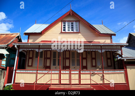 Traditional wooden house with dormer windows and porch in Vieux Fort, St Lucia Stock Photo