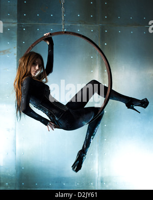 Young slim woman in black on ring. Stock Photo