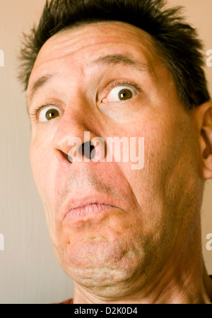 Photo of an attractive man with a very silly expression. Stock Photo