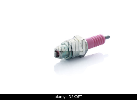 Old pink ceramic and steel spark plug isolated on white with reflection Stock Photo