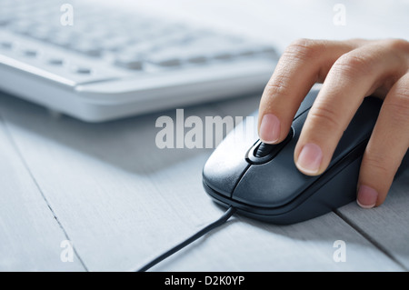 female hands using a computer on light background Stock Photo