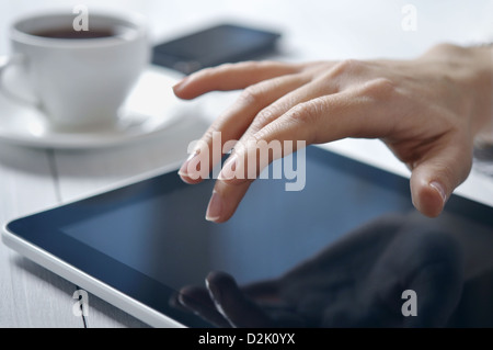 Hands of businesswoman using tablet PC at office Stock Photo