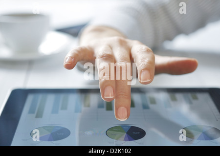 Businesswoman working on digital tablet at office  Stock Photo