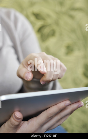 young woman using tablet pc at home Stock Photo