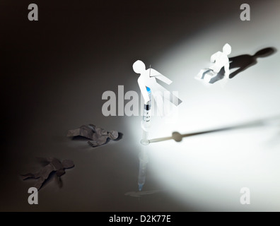 The conceptual image on a theme of narcotic dependence, white reflective background. Stock Photo