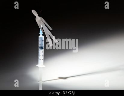 The conceptual image on a theme of narcotic dependence, white reflective background. Stock Photo