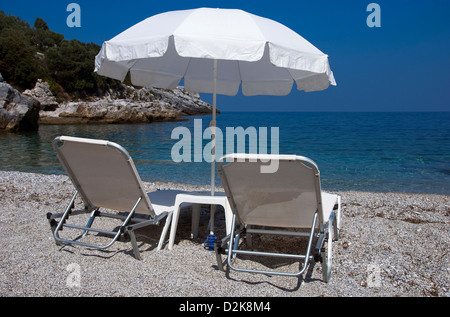 Vacant beach chairs on Greek beach Stock Photo