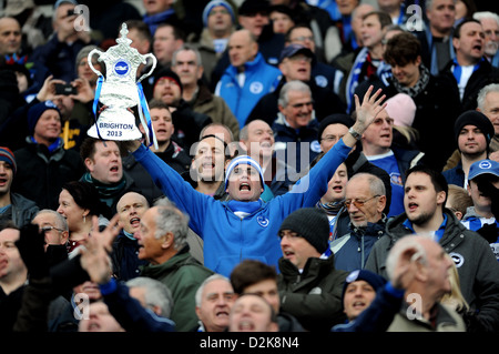 Brighton football fan holding aloft a mock FA Cup trophy at a match in the Amex Stadium UK Stock Photo