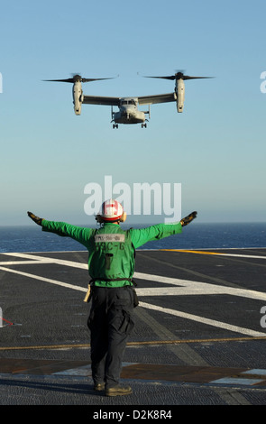 An MV-22 Osprey lands on the flight deck of the aircraft carrier USS Nimitz October 6, 2012 in the Pacific Ocean. Stock Photo