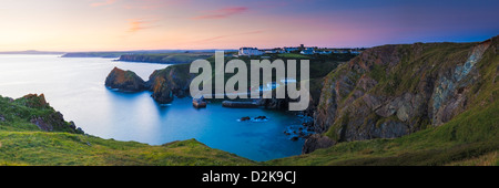 Sunset overlooking Mullion Cove Cornwall England UK Stock Photo