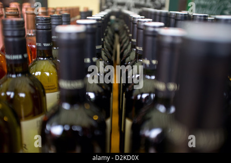 A group of wine bottles in a close up shot Stock Photo