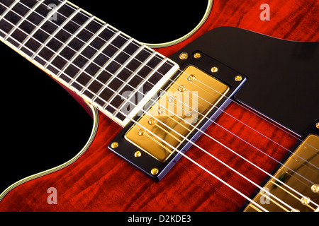 red electric guitar isolated on black background, closeup Stock Photo
