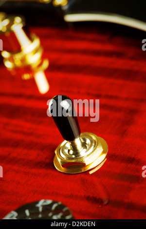 red electric guitar part, pickup toggle switch, closeup Stock Photo