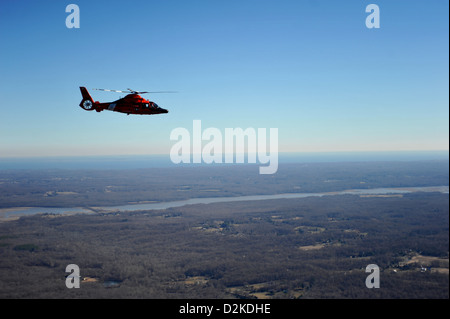 A Coast Guard MH-65 Dolphin helicopter aircrew from Coast Guard Air Defense Facility Washington, D.C., conducts training exercises over southern Maryland within the National Capitol Region, January 19, 2013. Coast Guard aircrews from Coast Guard Air Defen Stock Photo